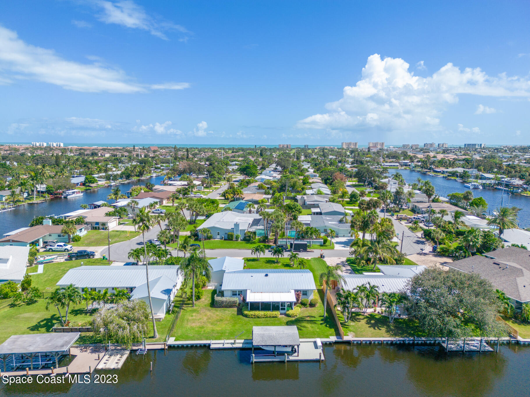 209 River Road Satellite Beach, FL 32937 - Photo 60 of 86 an aerial view of residential houses with outdoor space and swimming pool