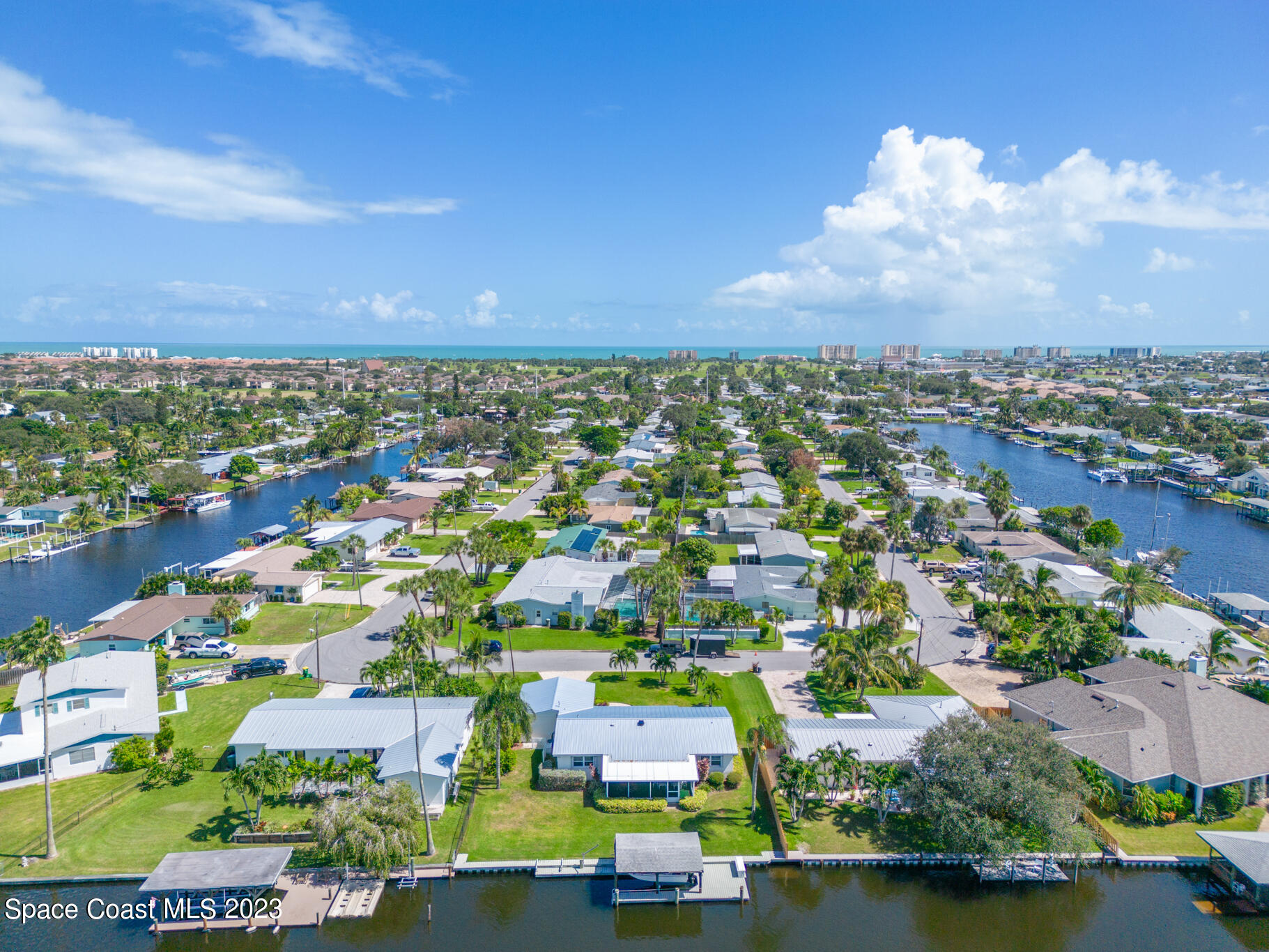 209 River Road Satellite Beach, FL 32937 - Photo 61 of 86 an aerial view of residential houses with outdoor space and lake view