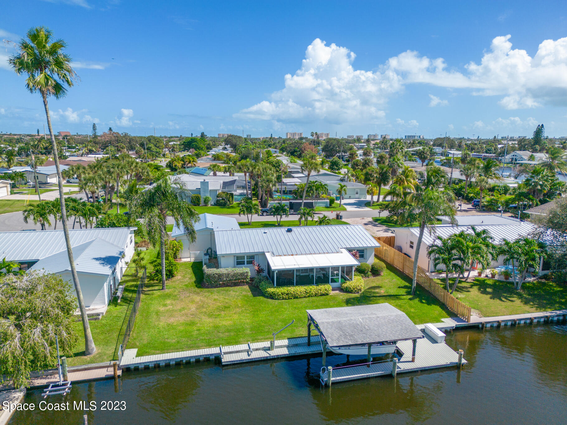 209 River Road Satellite Beach, FL 32937 - Photo 65 of 86 an aerial view of a house with a garden and lake view