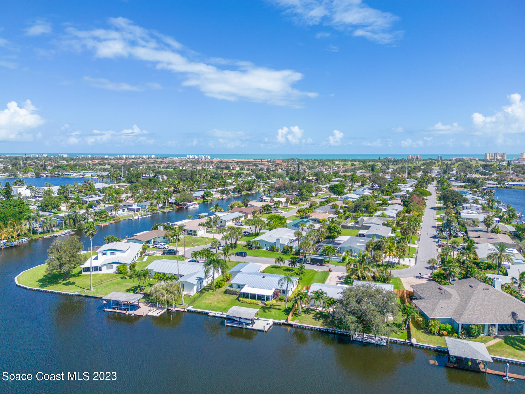 209 River Road Satellite Beach, FL 32937 - Photo 71 of 86 an aerial view of residential houses with outdoor space and swimming pool