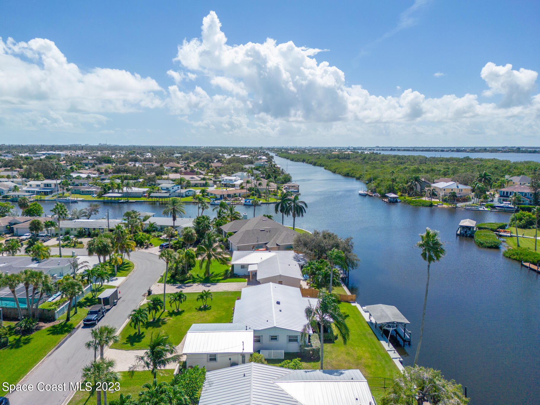 209 River Road Satellite Beach, FL 32937 - Photo 8 of 86 an aerial view of a house with a lake view