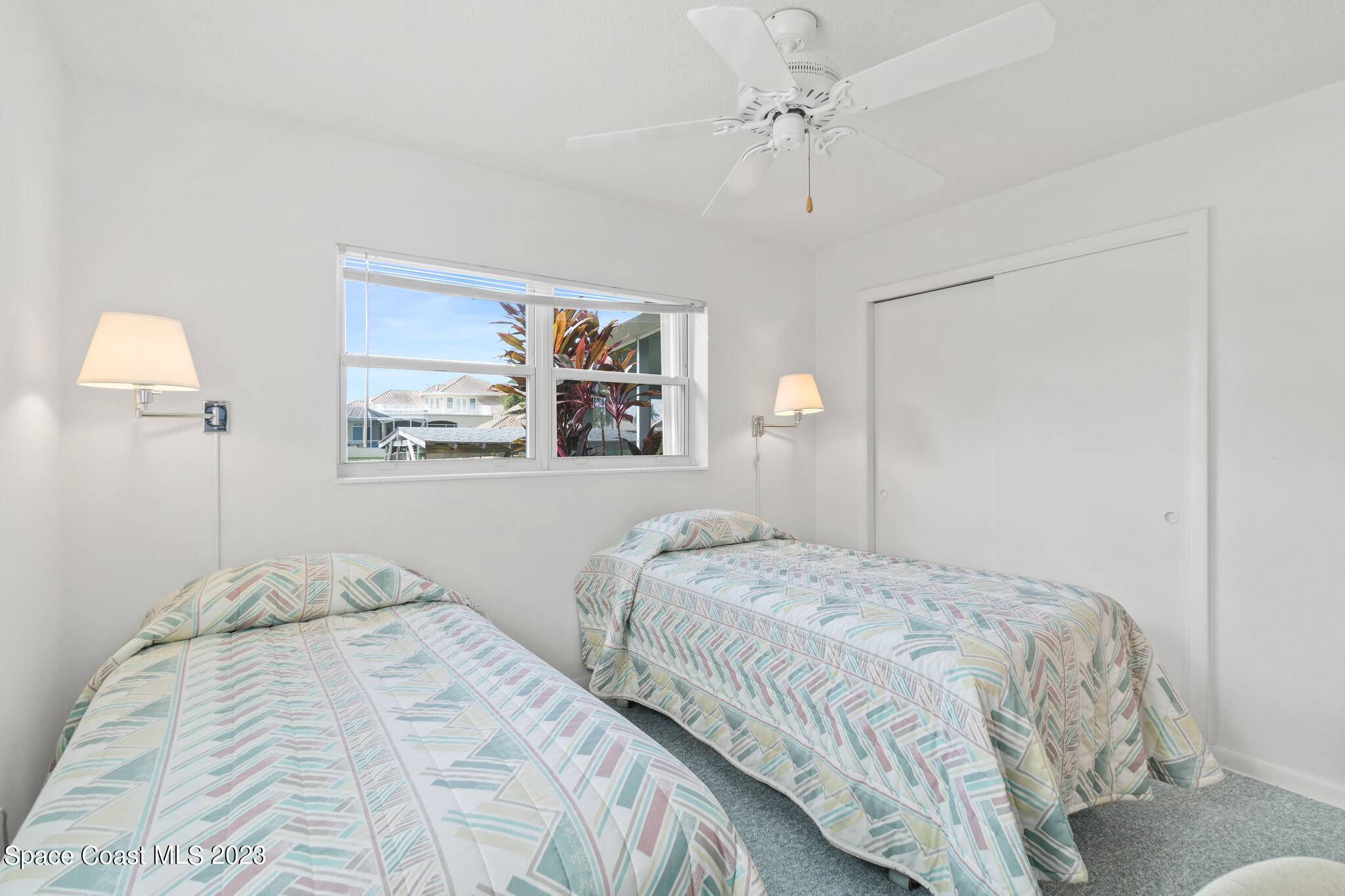 209 River Road Satellite Beach, FL 32937 - Photo 81 of 86 a bedroom with a bed and a painting on the wall
