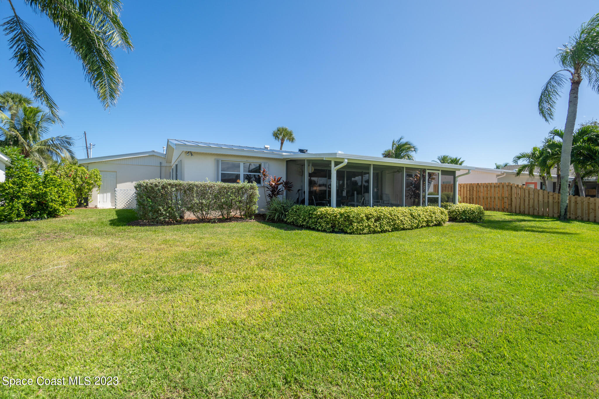 209 River Road Satellite Beach, FL 32937 - Photo 85 of 86 a view of a house with backyard and sitting area