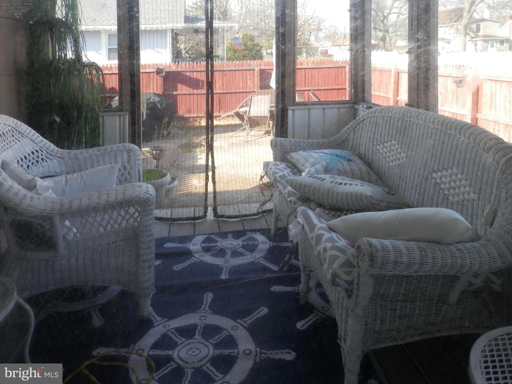 315 Dauphin Street Riverside, NJ 08075 - Photo 22 of 25 a living room with furniture and a floor to ceiling window