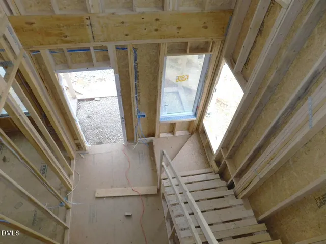 a black and white photo of a bench in a bathroom
