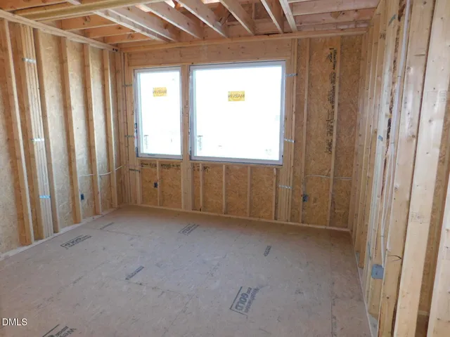 a picture of a room with a white curtain and a shower curtain