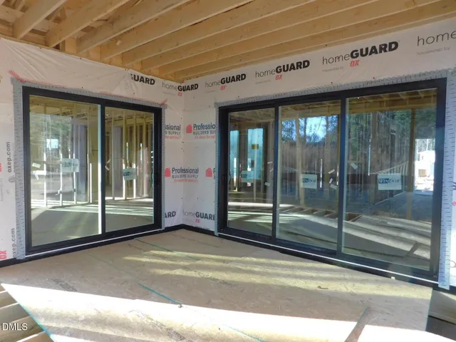 a view of a porch with a wooden floor