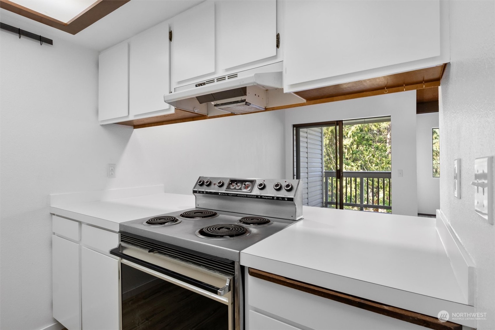 2 Marigold Drive, Unit 26 Bellingham, WA 98229 - Photo 8 of 26 a kitchen with a stove and white cabinets