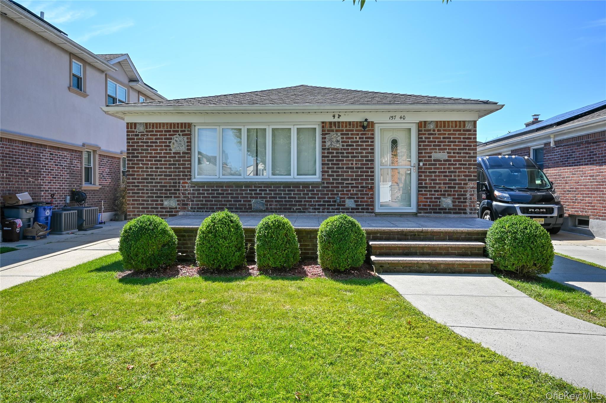 157-40 24th Road Queens, NY 11357 - Photo 1 of 1 a front view of a house with garden