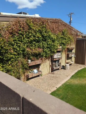 a view of a terrace with yard