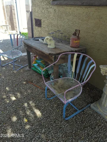 a view of a backyard with furniture and a window