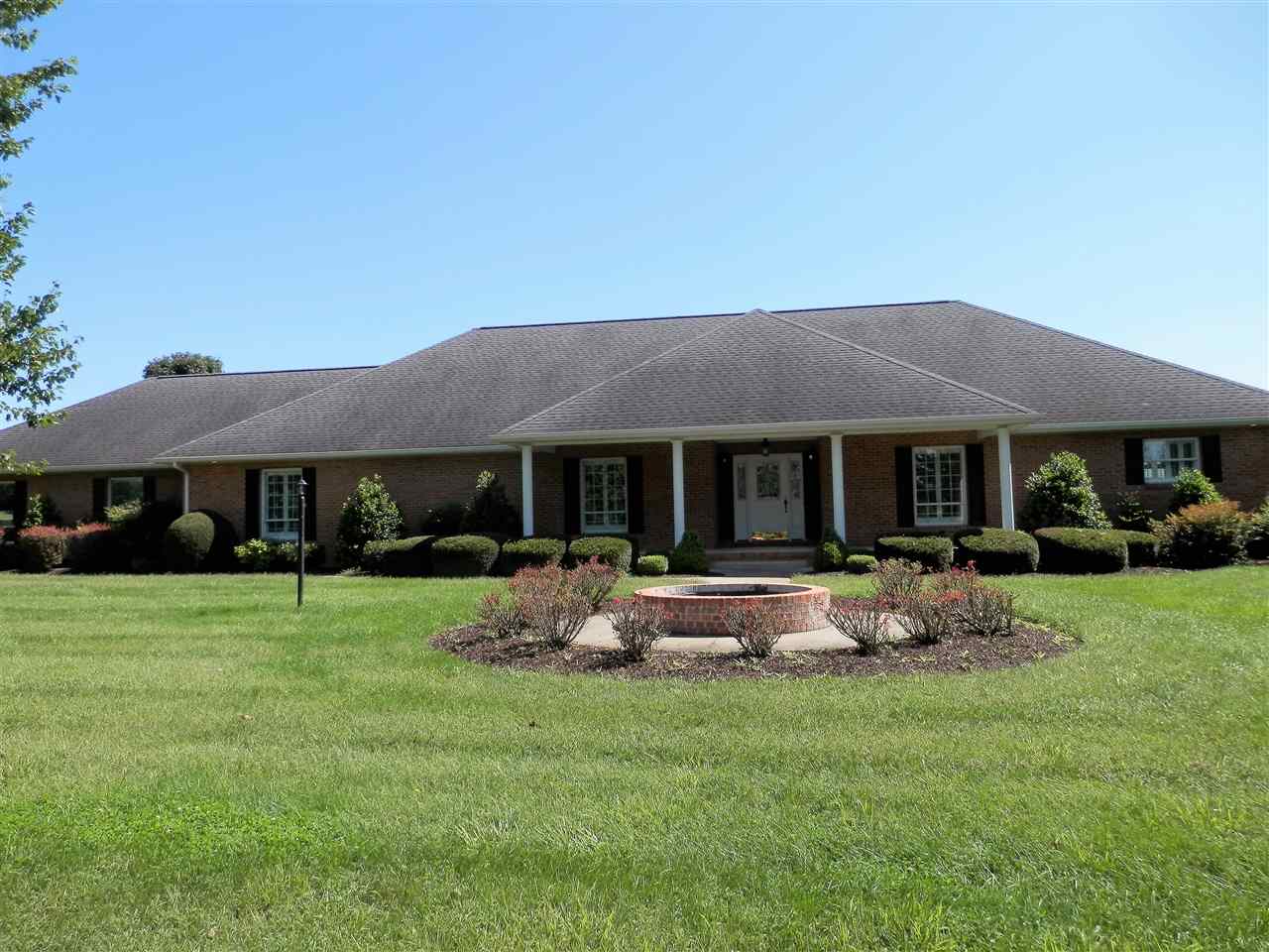 a front view of a house with garden and porch