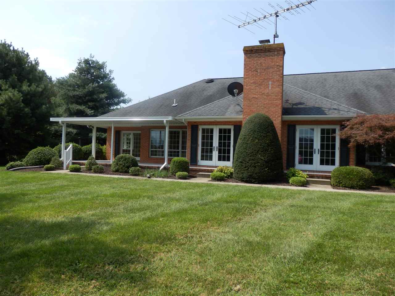 469 Coleytown Road Waynesboro, VA 22980 - Photo 46 of 47 a front view of a house with a garden and porch
