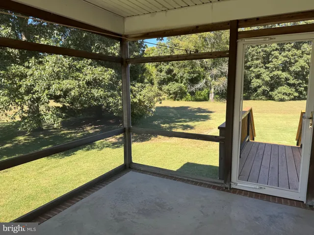 a view of an outdoor area with a floor to ceiling window