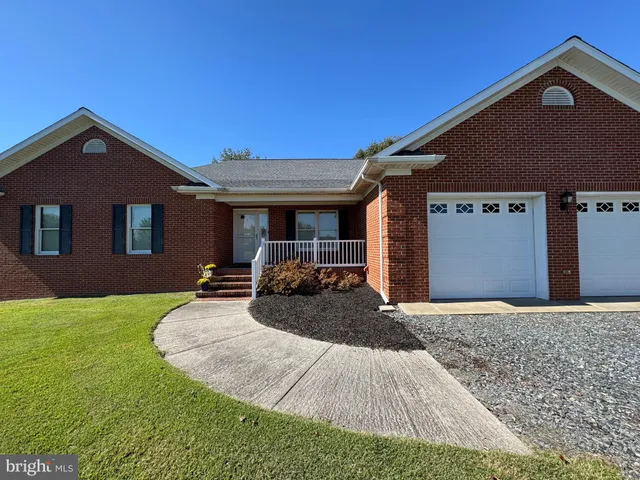 a front view of a house with yard