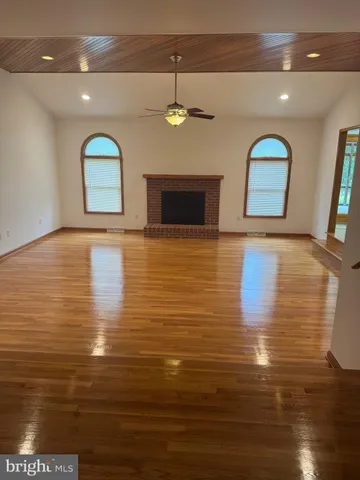 a view of a livingroom with wooden floor