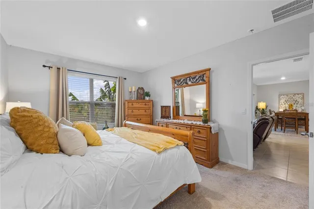 a bedroom with a bed and glass windows