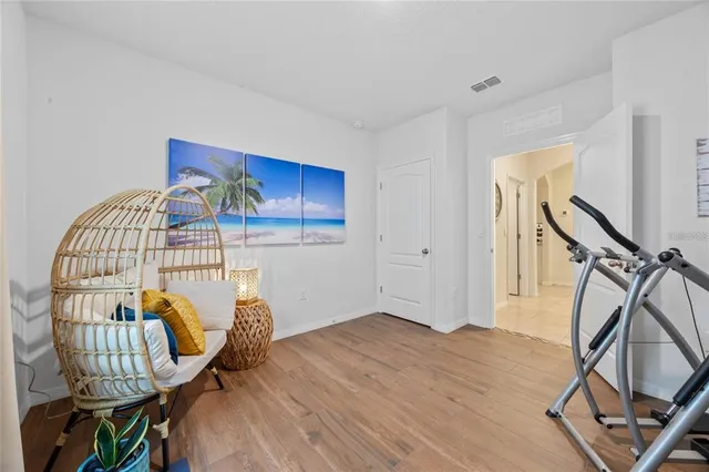 a view of an entryway with wooden floor