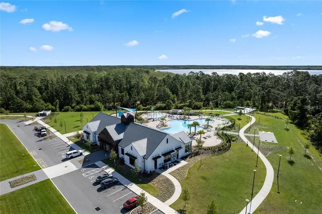 a view of a swimming pool and lounge chairs