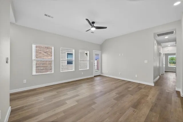 a kitchen with stainless steel appliances a refrigerator sink and microwave