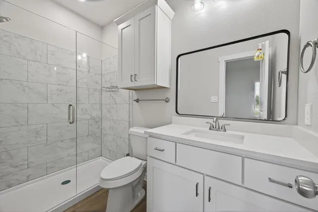 a bathroom with a toilet and shower