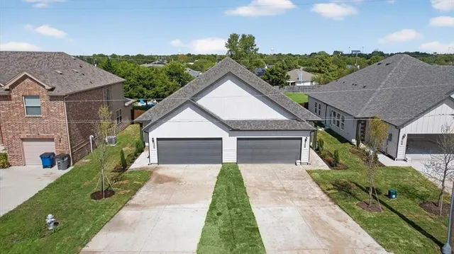 a aerial view of a house with a yard