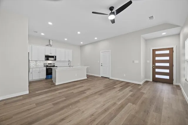 a view of an empty room with a window