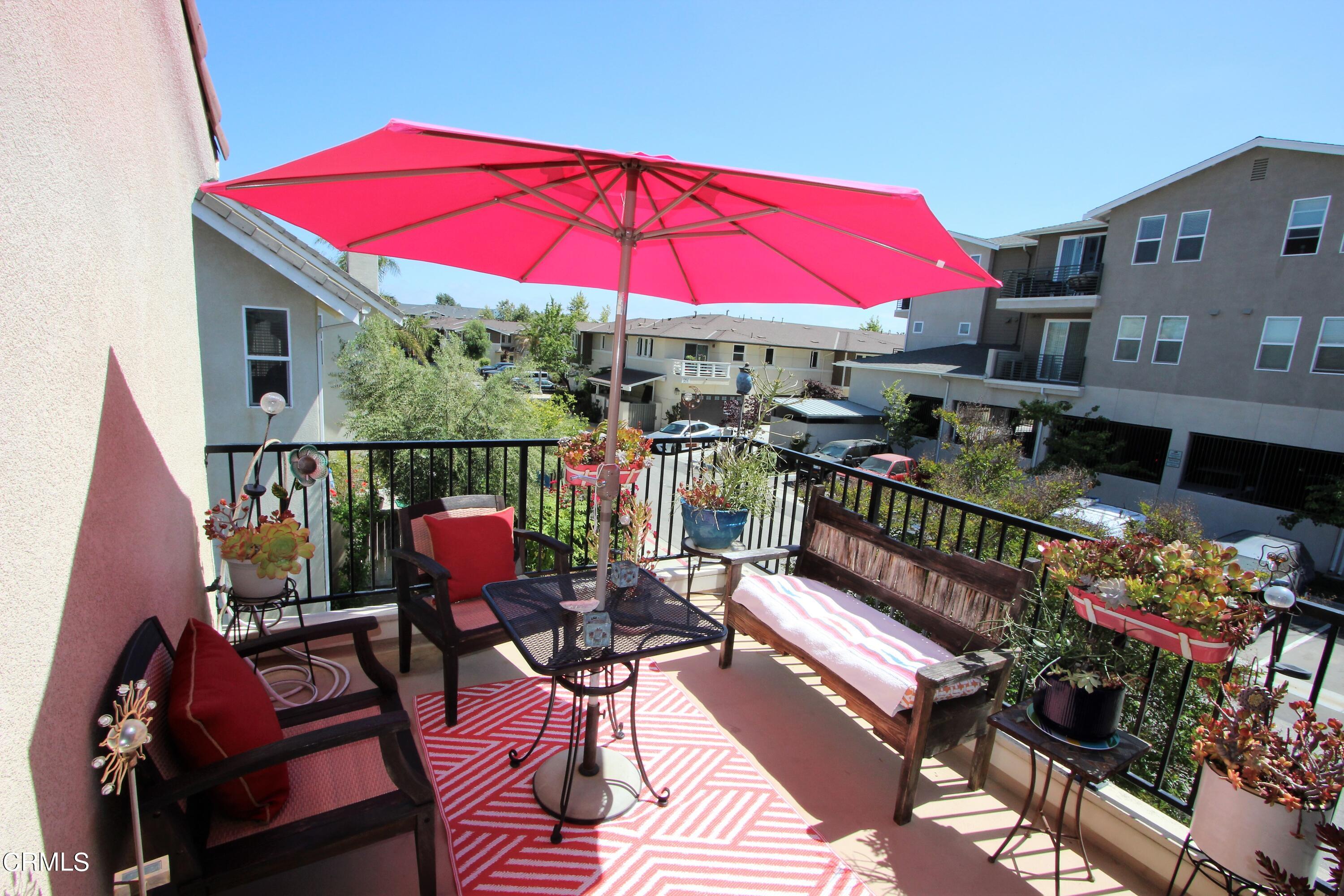 11172 Darling Road Ventura, CA 93004 - Photo 11 of 31 a view of a balcony with furniture and umbrella