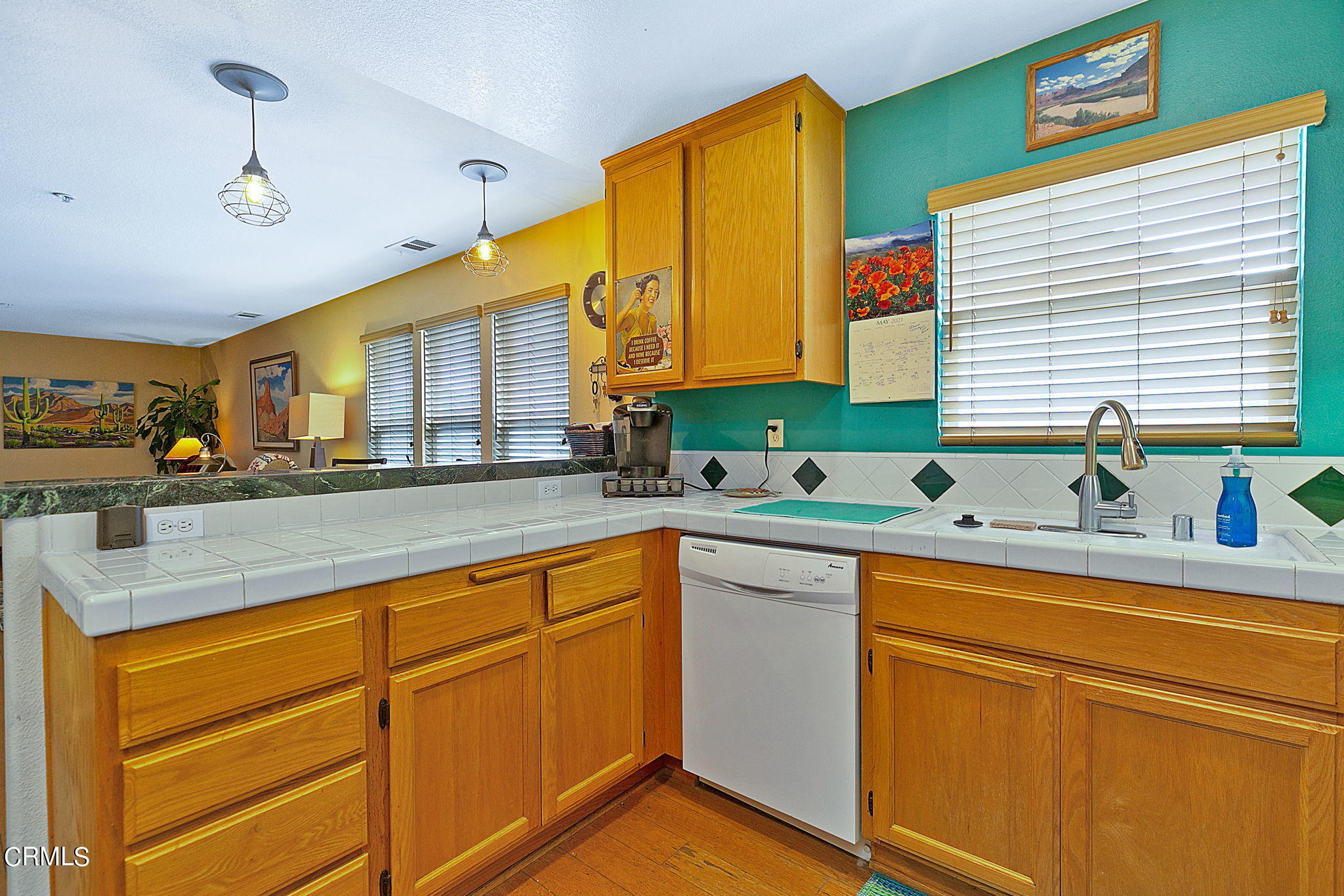 11172 Darling Road Ventura, CA 93004 - Photo 15 of 31 a kitchen with stainless steel appliances granite countertop sink stove and cabinets