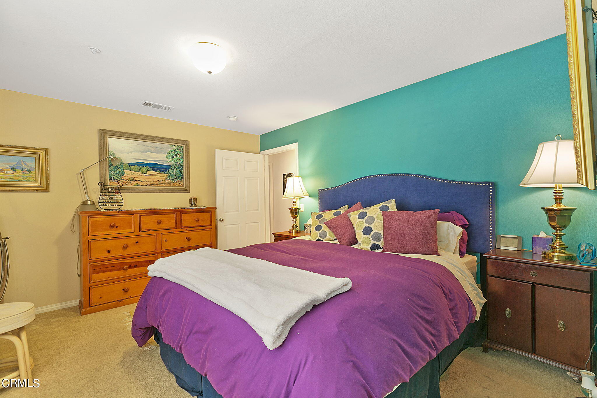11172 Darling Road Ventura, CA 93004 - Photo 23 of 31 a bedroom with a bed and a lamp on dresser