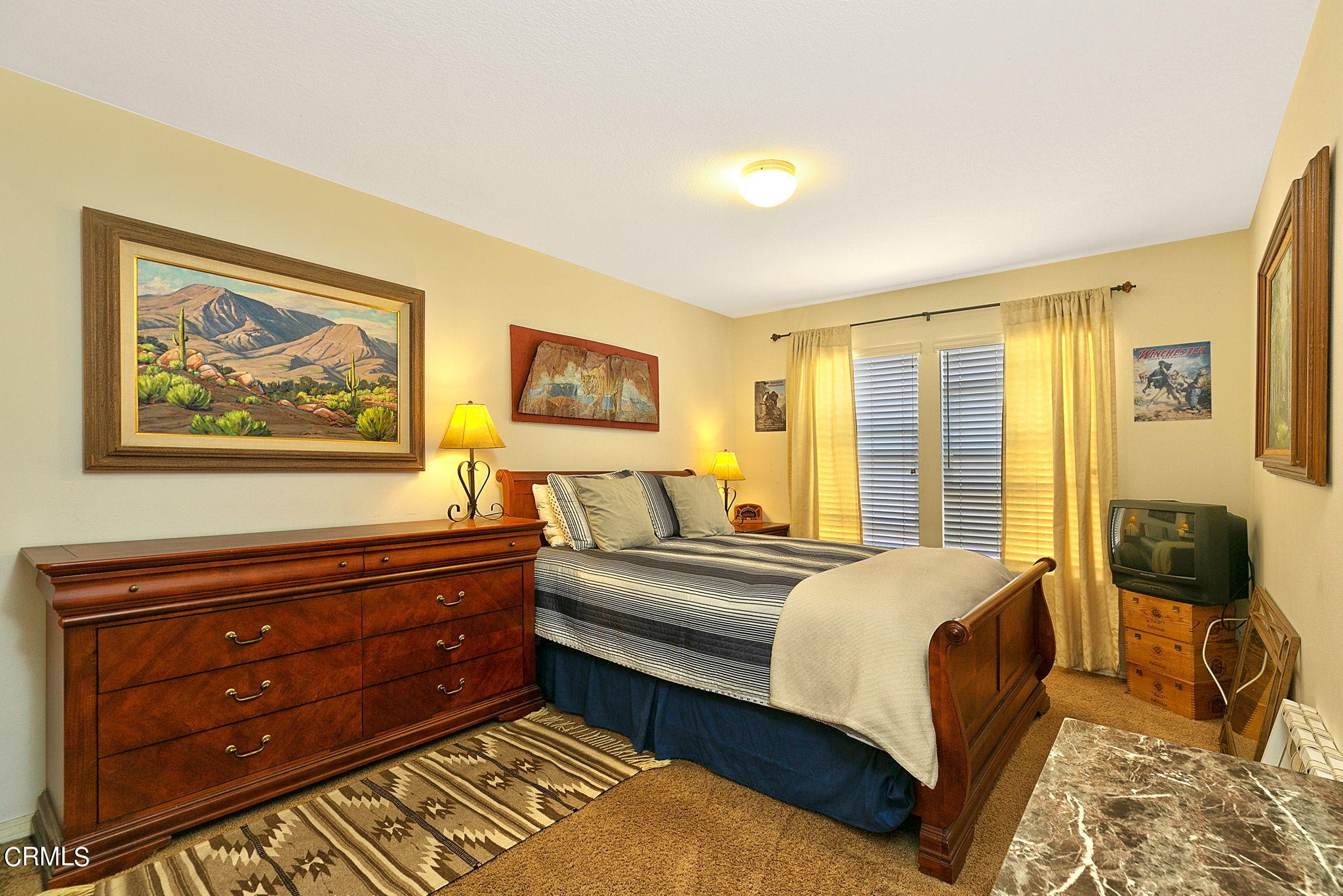 11172 Darling Road Ventura, CA 93004 - Photo 25 of 31 a bedroom with a bed and wooden floor