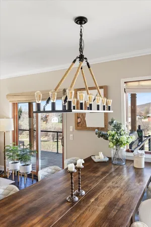 a view of a dining room with furniture window and wooden floor