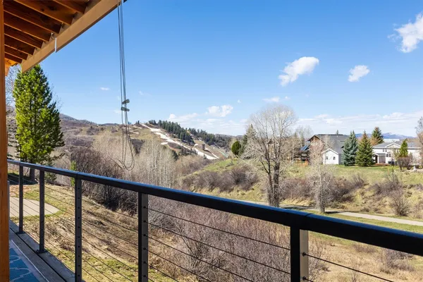 a view of a balcony with wooden floor