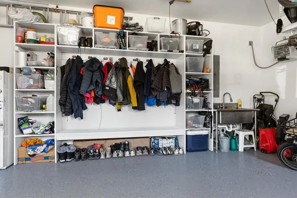 a bedroom with a large bed and a flat screen tv