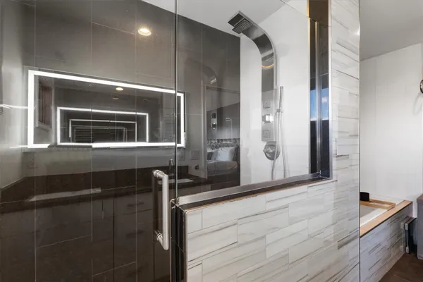 a bathroom with a bathtub and a sink
