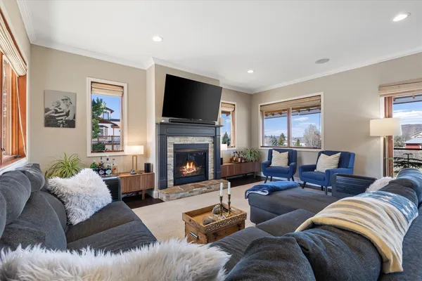 a living room with furniture fireplace and a flat screen tv