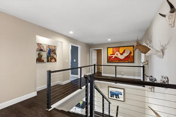 a bedroom with two beds and a flat screen tv