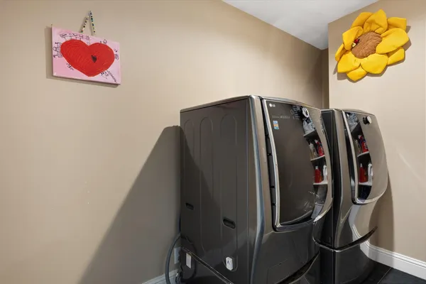 a kitchen with granite countertop wooden floor and white appliances