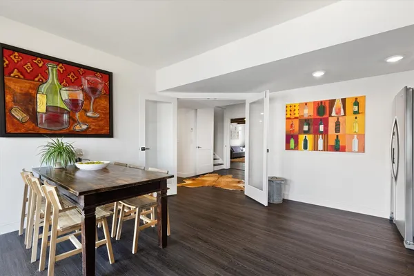 a living room with furniture rug and wooden floor