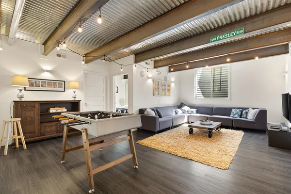a living room with furniture and a window