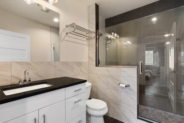 a bedroom with a bed and a cabinets