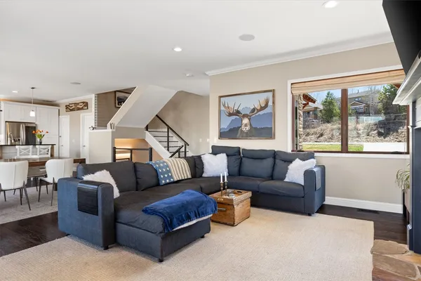 a living room with furniture and a large window