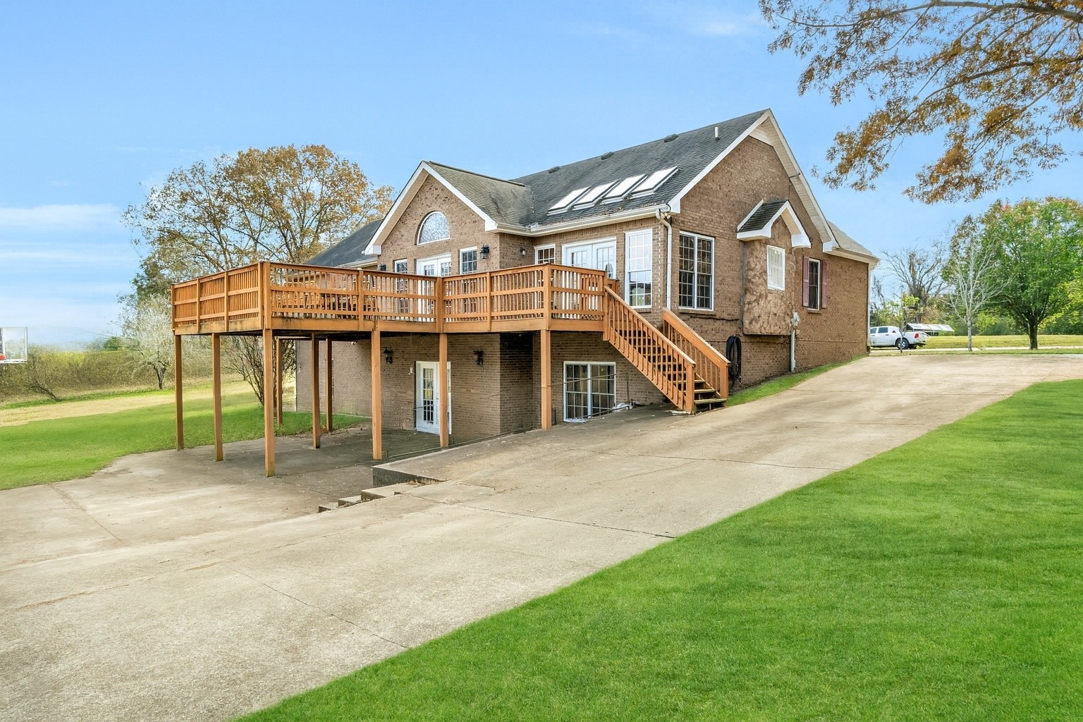 311 Downs Road Cumberland City, TN 37050 - Photo 1 of 30 a front view of a house with a yard and garage