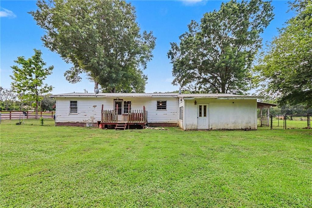 381 River Bend Road Southwest Plainville, GA 30733 - Photo 25 of 28 a view of a house with a yard