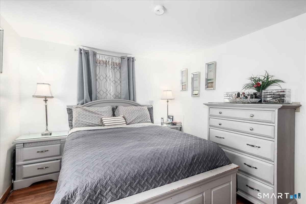 306 Welton Street Hamden, CT 06517 - Photo 14 of 38 a bedroom with a bed and a dresser