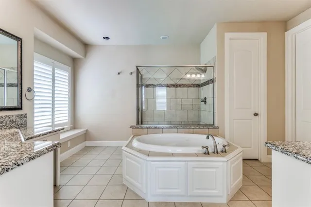 a bathroom with a bathtub and window