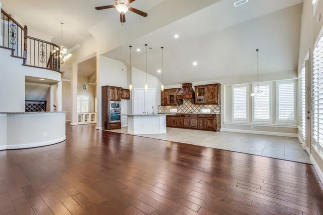 a kitchen with a stove and a wooden cabinets