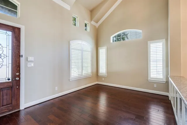 a view of an entryway with wooden floor