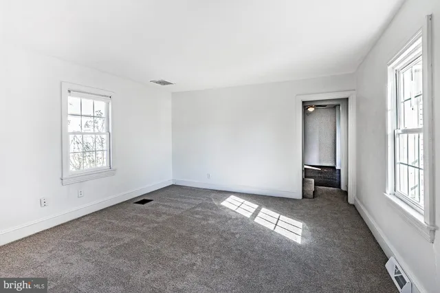 an empty room with windows