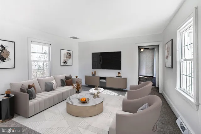 an aerial view of multiple houses with yard